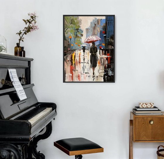 Woman with umbrella in a rainy city.