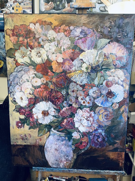 A lush bouquet in a pink vase