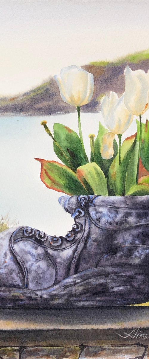 White tulips in old shoe planter sea view by Alina Karpova