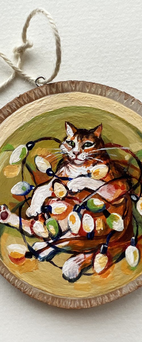 Christmas cat with a garland by Natalia Veyner