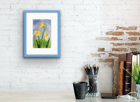 Yellow narcissus on a blue sky background