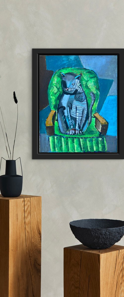 Cat in a green sofa by Roberto Munguia Garcia