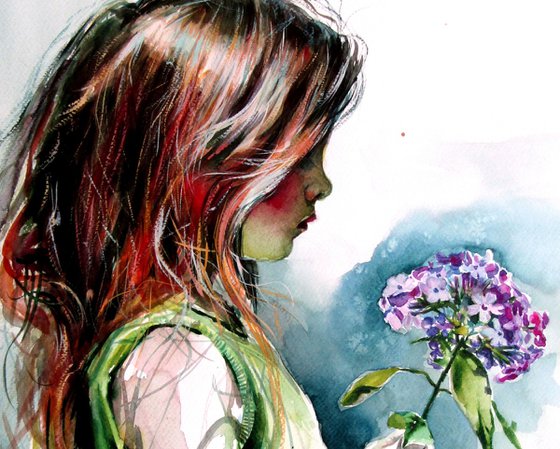 Little girl with purple flower