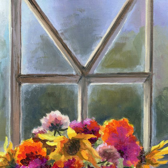 Vase of marigolds on a window