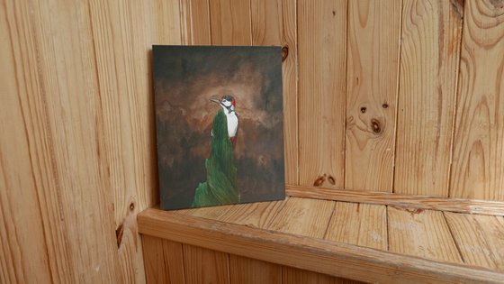 Woodpecker in the dark forest