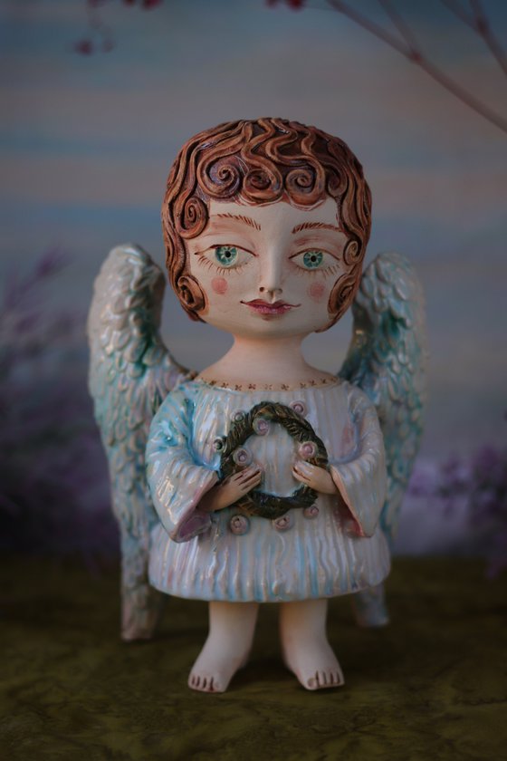 Angel with a flower.