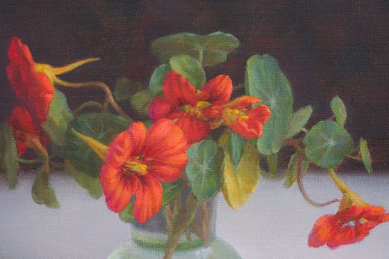 Nasturtiums in green vase