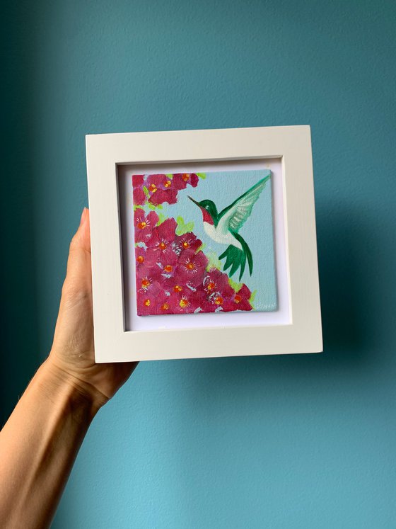 Hummingbird and tropical flowers