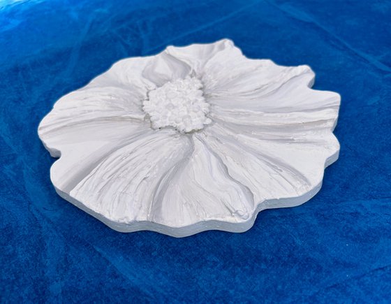 Small white sculptured  flower