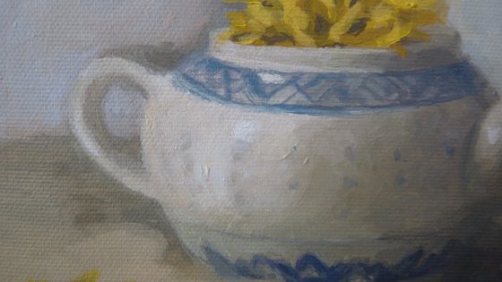 Teapot with yellow flowers