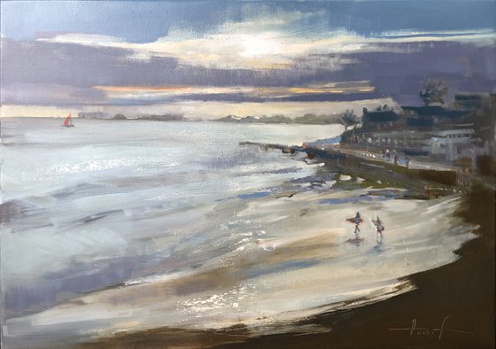 Surfing at sunset
