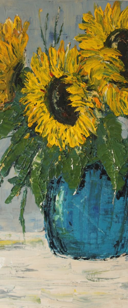 Sunflowers in blue pot. by John Halliday