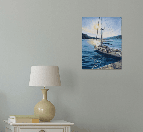 Yacht at anchor at sunset