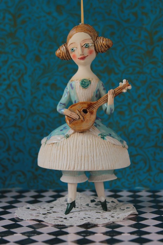 Girl with a mandoli. Ceramic hanging sculpture