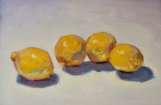 four lemons on white background