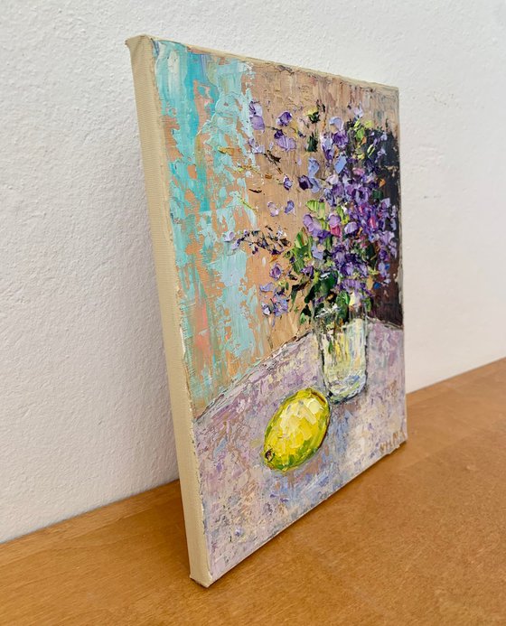 Still life with flowers and lemon