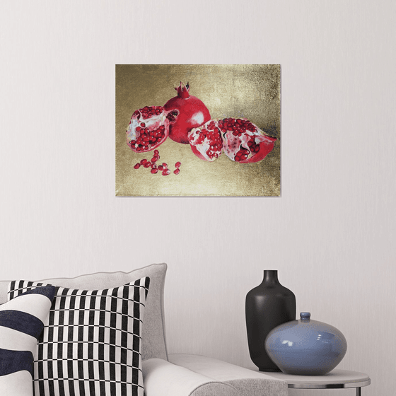 Pomegranate fruit on gold