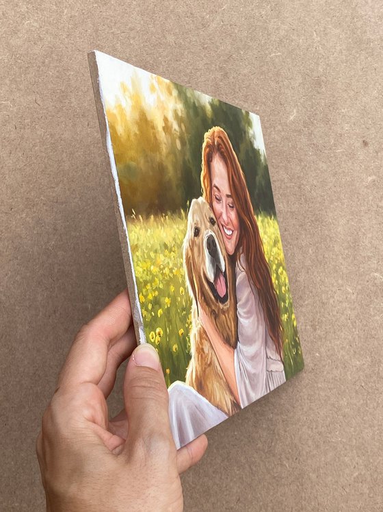Smiling red-haired woman hugging a dog