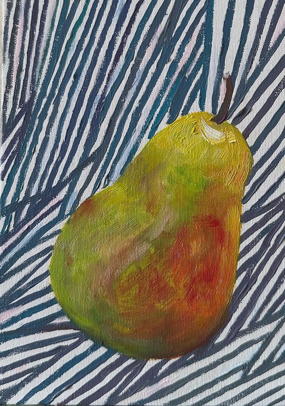 Green pear on blue