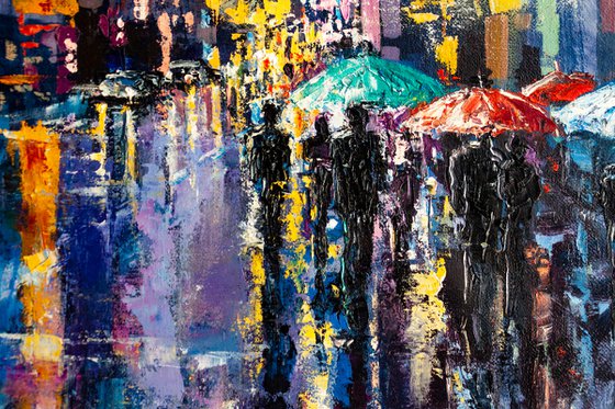 Night city lights, people with umbrellas