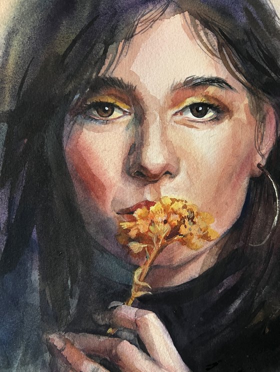 Portrait of a girl with a flower