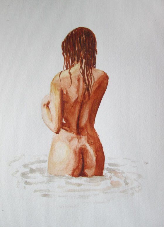 Nude standing in water