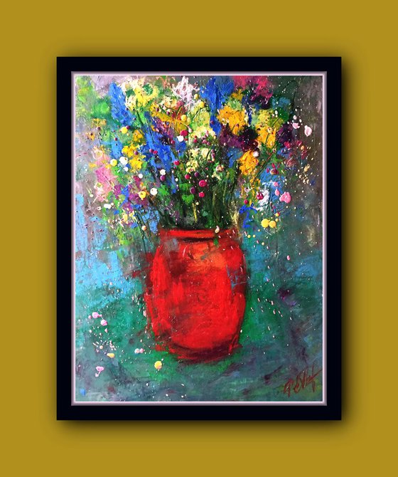 Red vase and meadow flowers