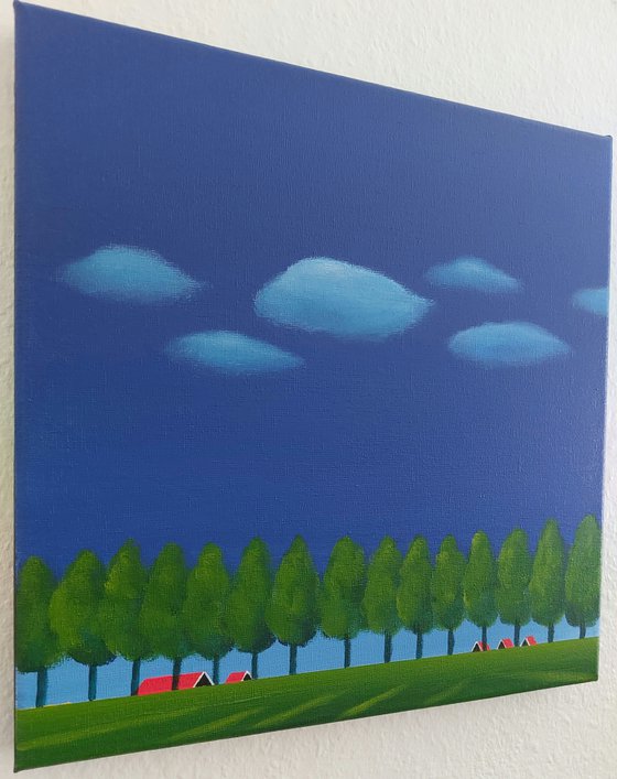 Dike with trees, floating clouds