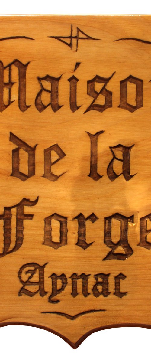 carved panel: House of the forge Aynac by Jonathan Pradillon
