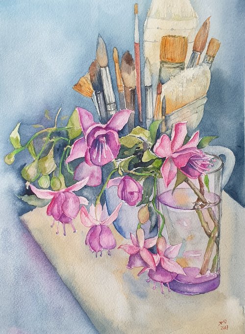 Fushia flowers on painter's table by Ksenia June