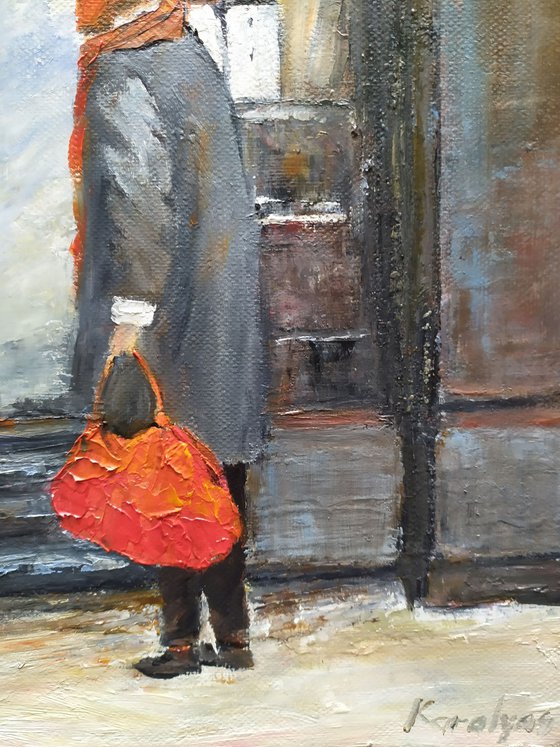 The woman with red bag