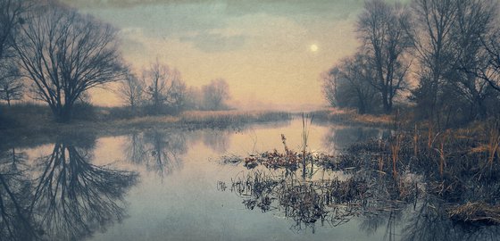 Full moon over a quiet bay.