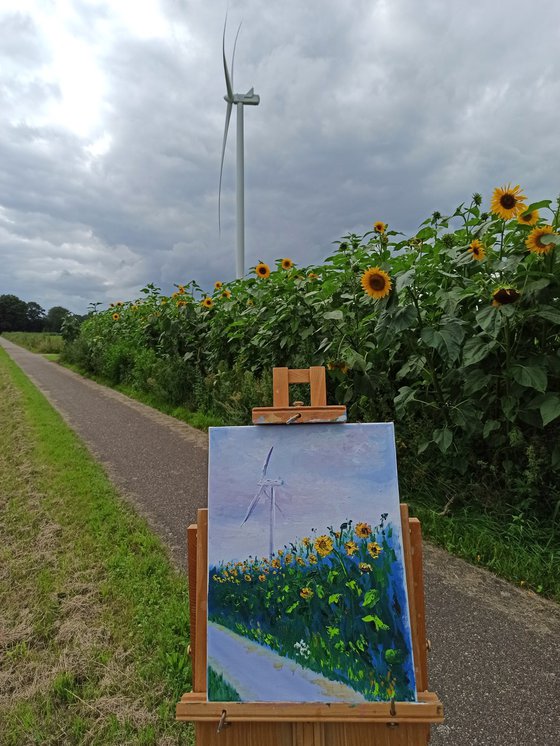 Sunflowers and a contemporary windmill. Pleinair painting