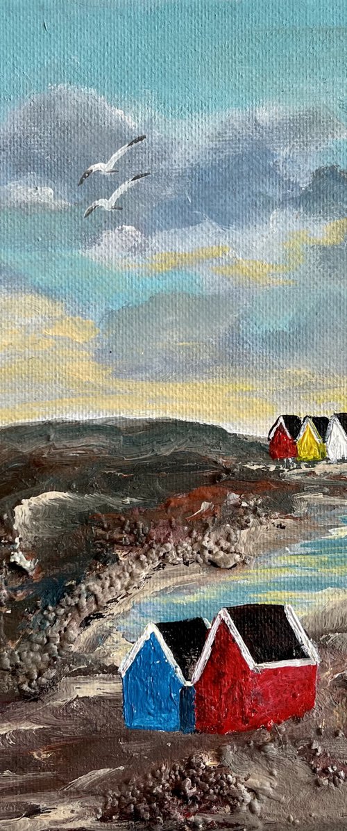 Beach Huts in a Cove by Marja Brown