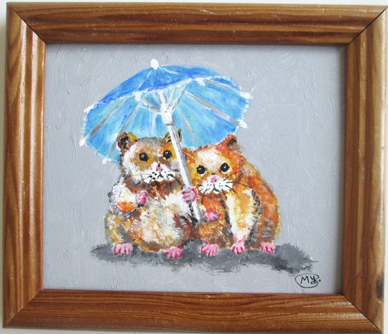 Lovely Hamsters together under a parasol