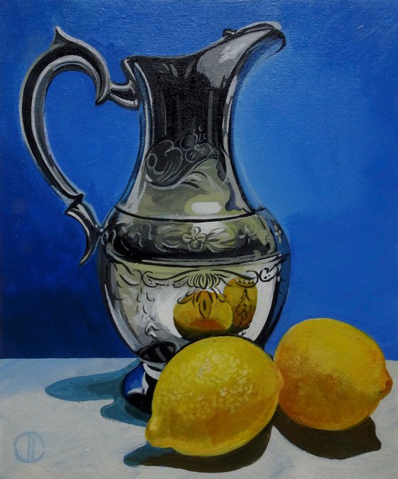 Still life water jug and lemons
