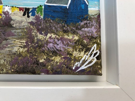 Three beach huts on the beach