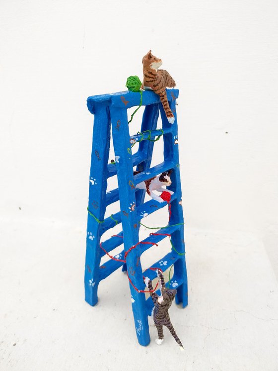 Cats on ladder