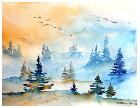 Sunrise in the misty forest.