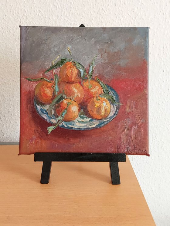 Still life with fruits "Tangerines on red"