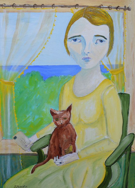 Woman with cat holding letter