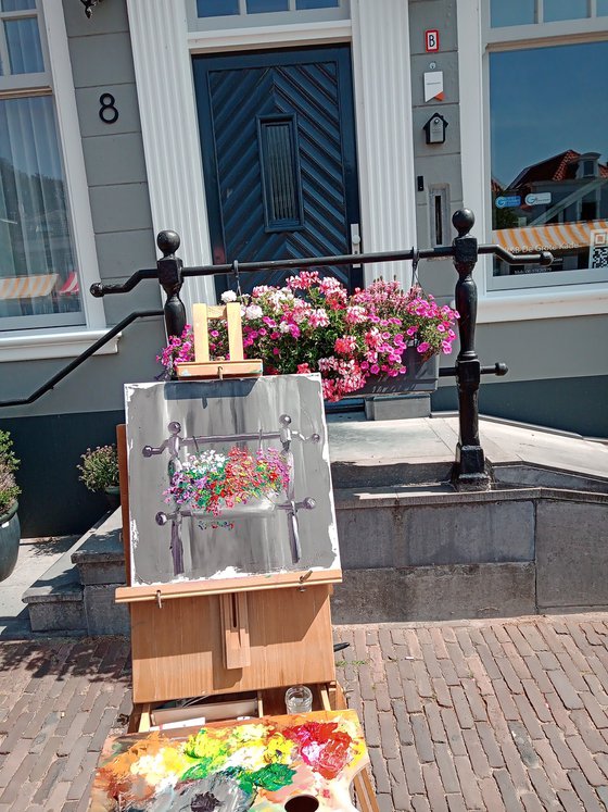 The flowers in the pot by the entrance. Plein air painting