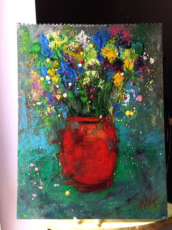 Red vase and meadow flowers