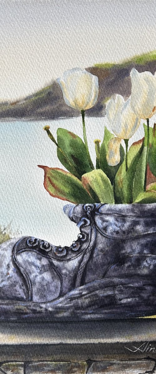 White tulips in old shoe planter sea view by Alina Karpova