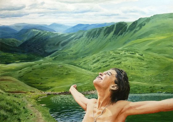Embracing the world - large mountain landscape with woman portrait after swimming in the highland lake