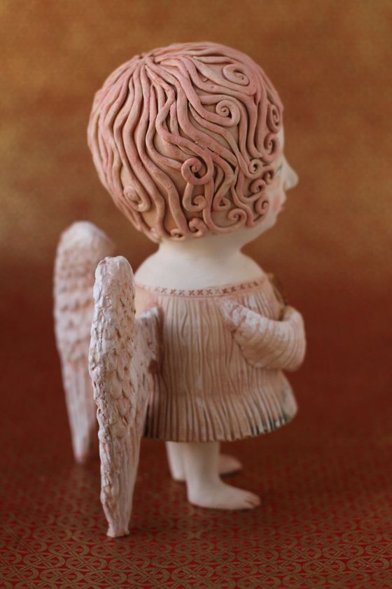Angel holding a key. Ceramic OOAK sculpture by Elya Yalonetski