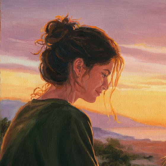 Girl watching the sunset with her tabby cat