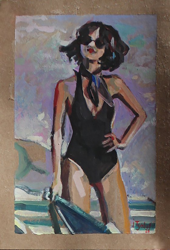Girl in a black swimsuit On the beach