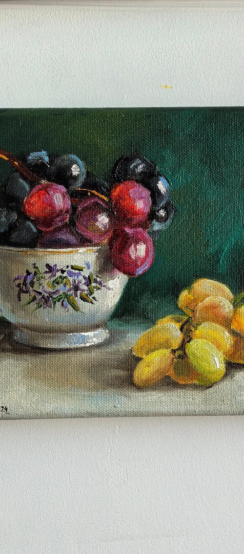 grapes in porcelain cup by Leyla Demir