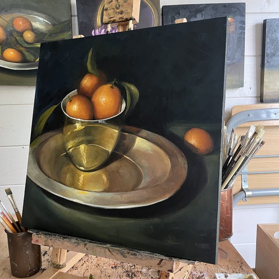 Kumquats in a gold bowl